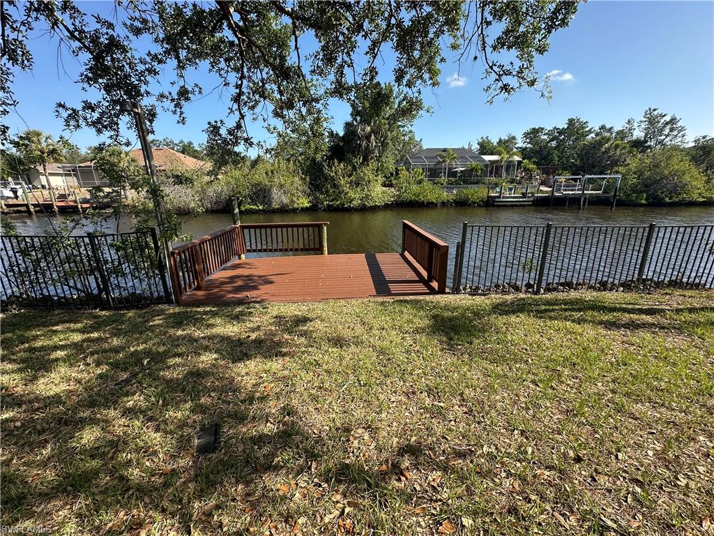 From living room, dining area and kitchen to the left.  Leads out to the bonus room, Florida Room and waterfront.
