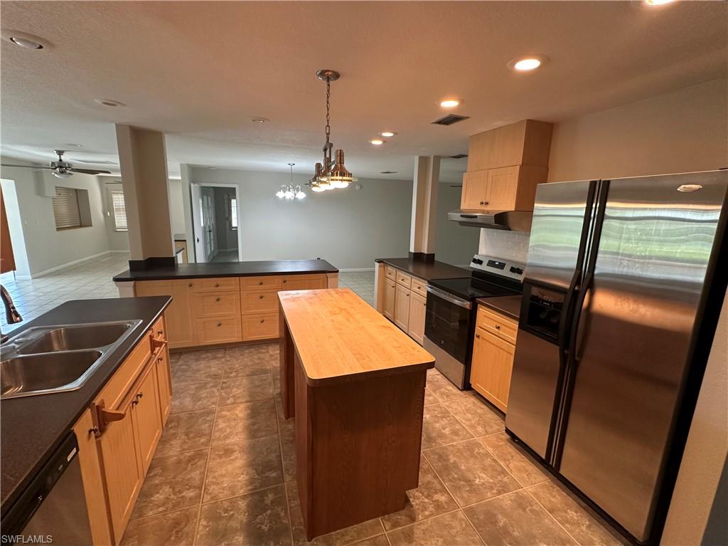 Bonus room behind the living room, primary bedroom, kitchen areas and Florida Room to the left leading to the water frontage.