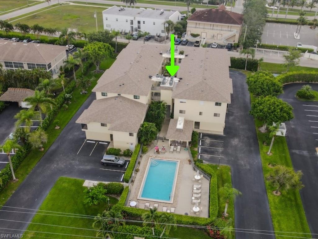 Aerial perspective of suburban area with a pool area