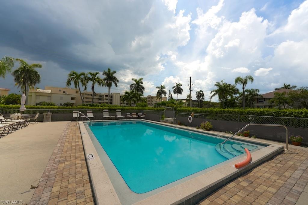Community pool featuring a patio