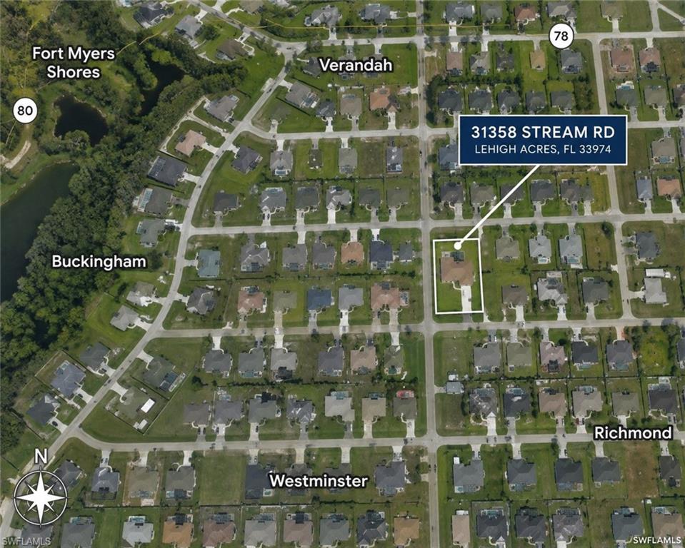 Aerial Map. Displaying the property location at 31358 Stream Rd, Lehigh Acres, FL 33974, within a residential area