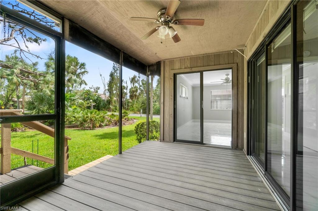 Unfurnished sunroom featuring ceiling fan