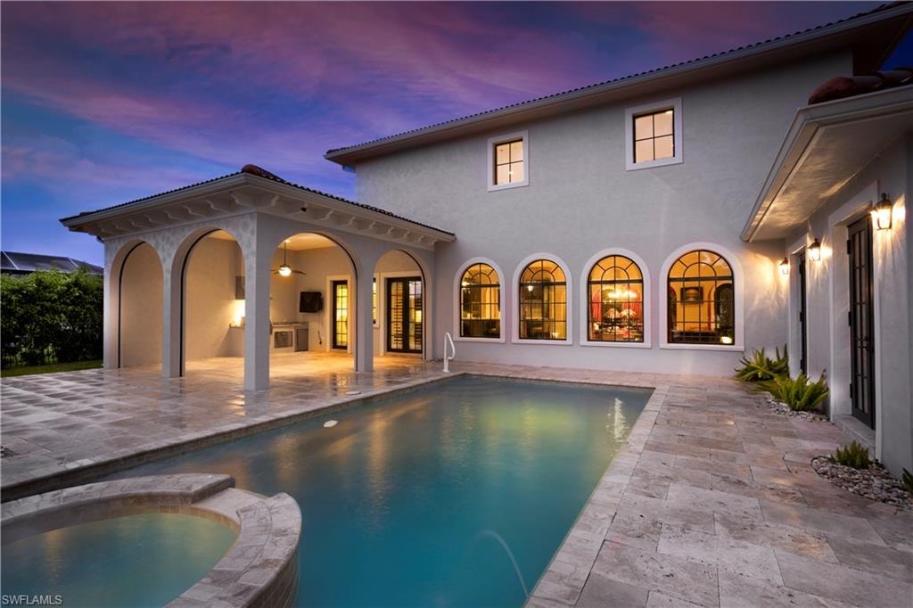 Private Lanai with impact screened cabana, outdoor kitchen,travertine deck and custom pool/spa