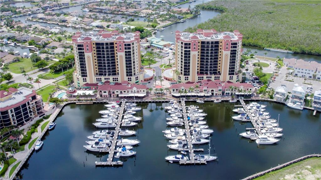 Cape Harbour Marina located inside community with restaurants and shops and newly opened 'Chiquita Pass' to right of condo tower opposite circular drive. Marina has direct sailboat access out to open water with wet slips, boat house dry storage, pump-out services, and marine fuel.