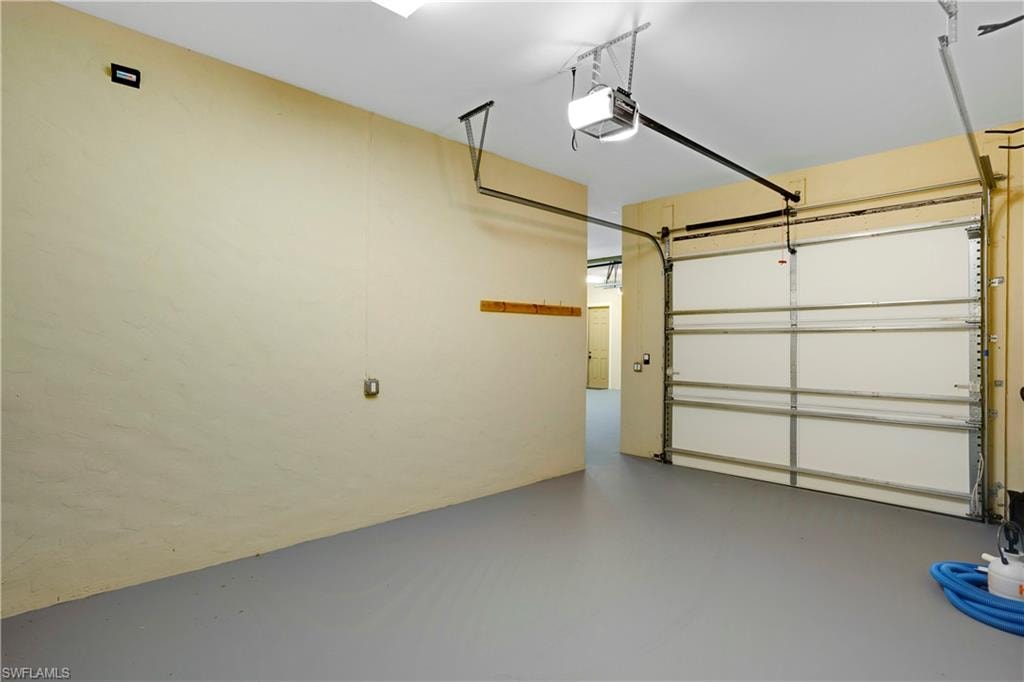 Garage featuring a garage door opener