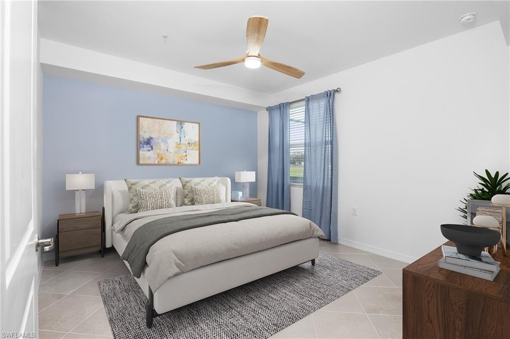 Bedroom featuring light tile patterned floors and ceiling fan