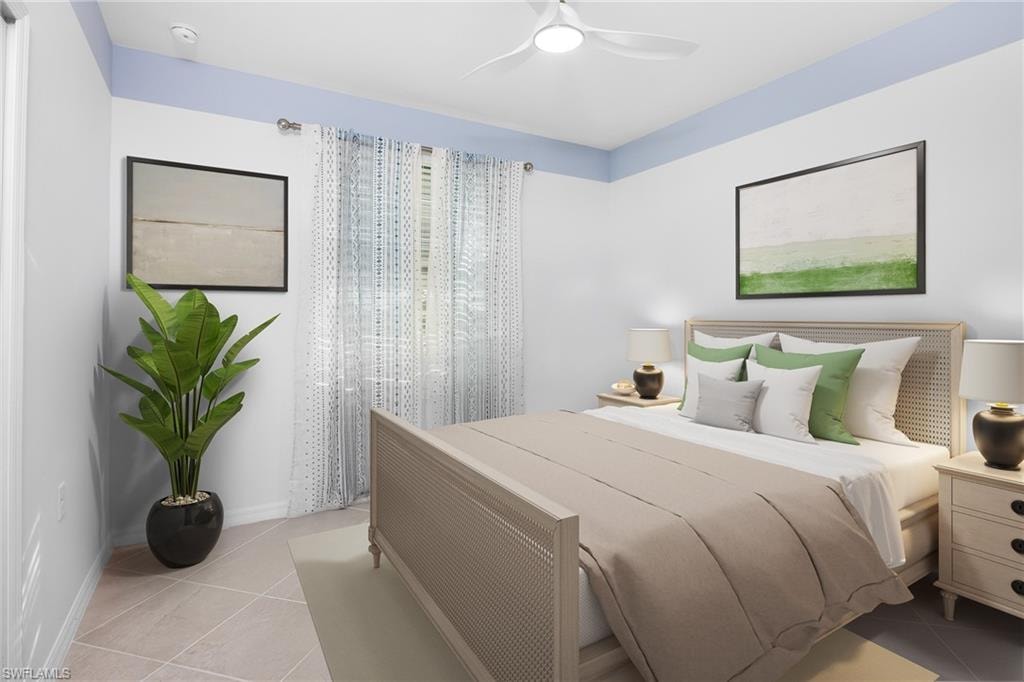 Bedroom featuring light tile patterned floors and ceiling fan