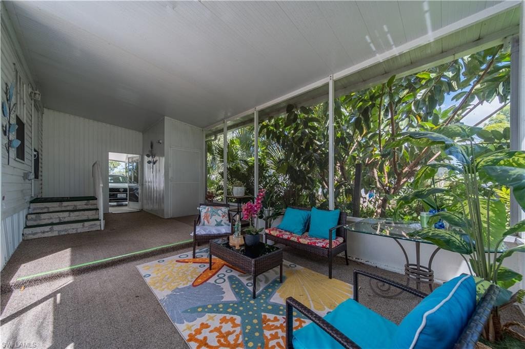 Sunroom / solarium with an outdoor living space
