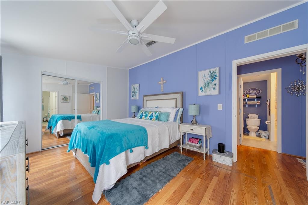 Bedroom featuring wood finished floors and a ceiling fan