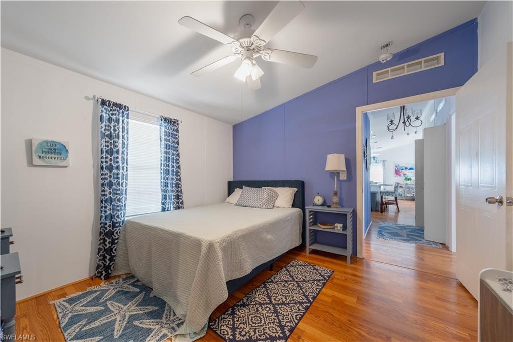 Bedroom with wood finished floors and a ceiling fan