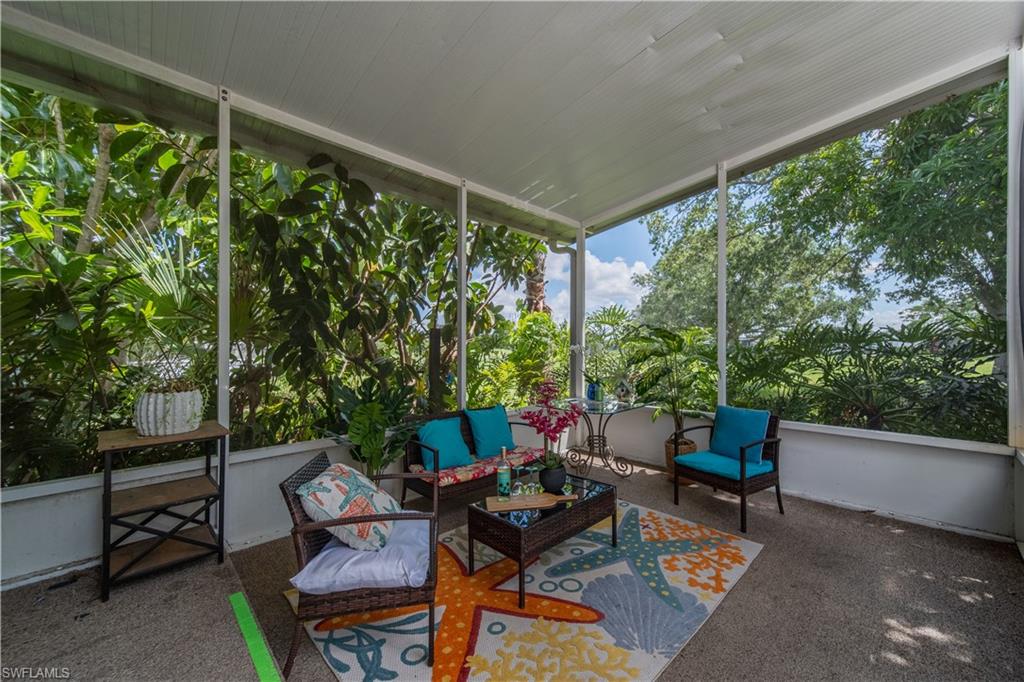 Sunroom / solarium with an outdoor living space