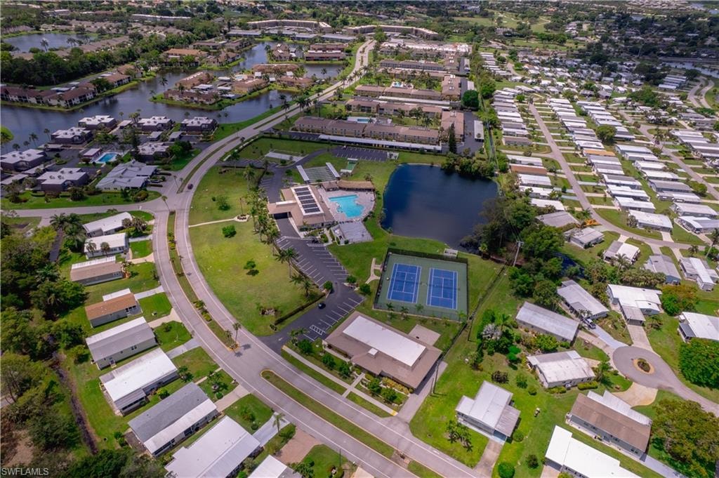 Aerial overview of property's location with a large body of water and nearby suburban area