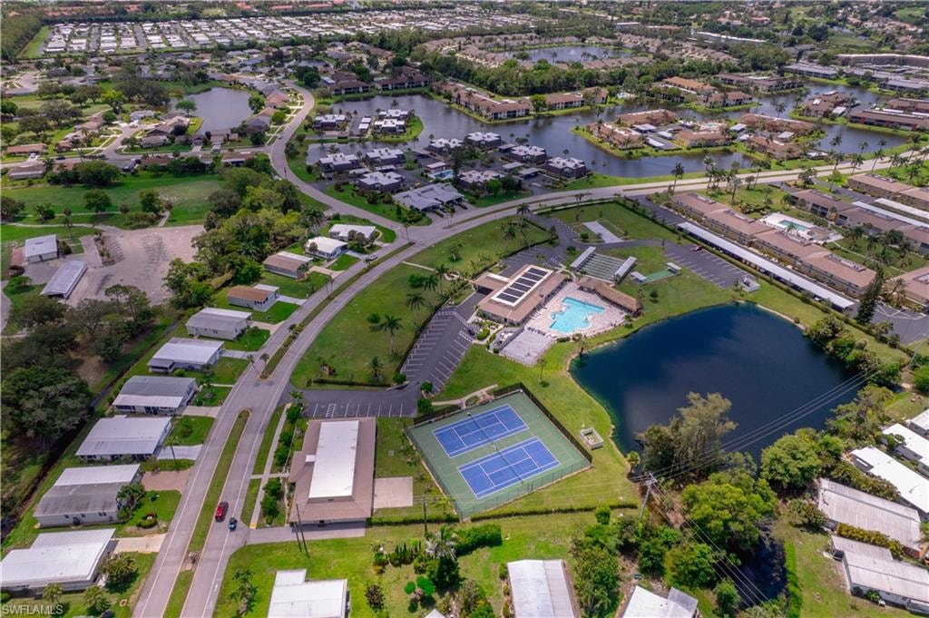 Aerial overview of property's location featuring a nearby body of water and nearby suburban area