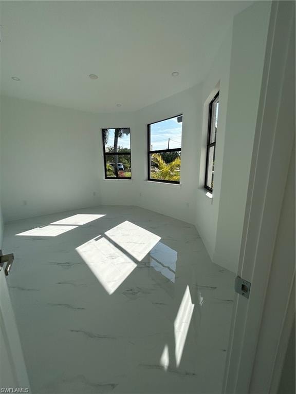 Empty room featuring marble finish flooring