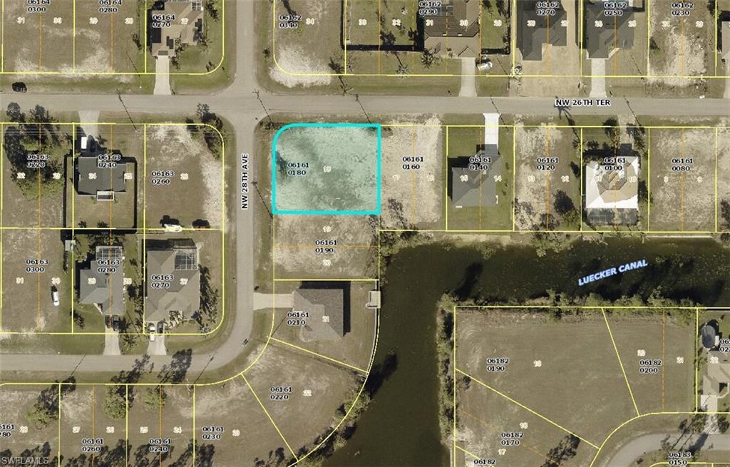 Aerial view of property's location featuring property parcel outlined