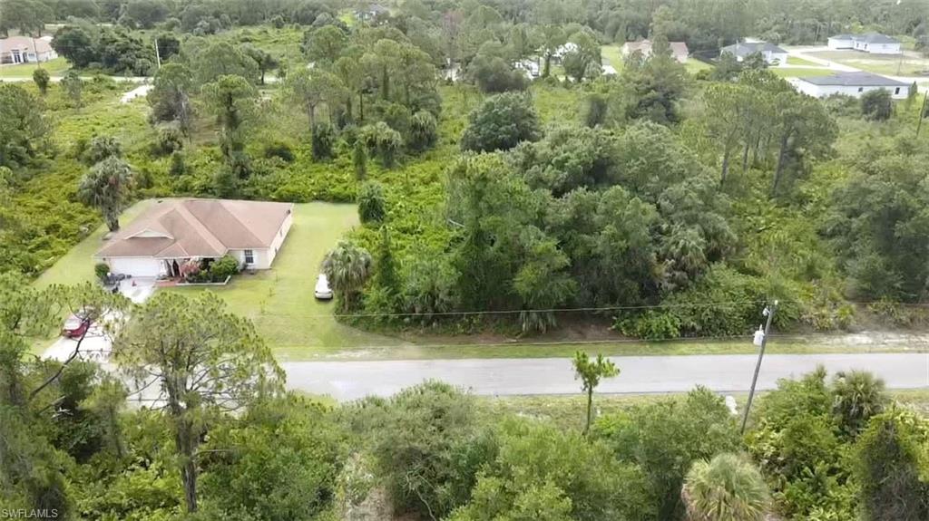 View of subject property featuring a forest
