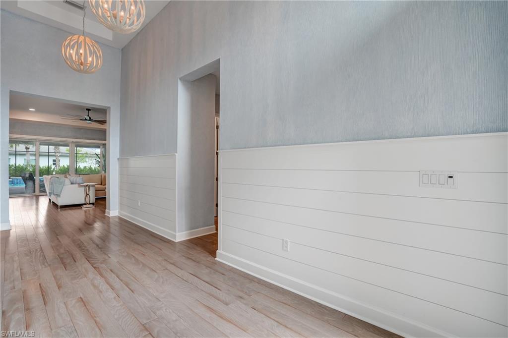 Volumes of height and warmth in this impressive shiplap foyer