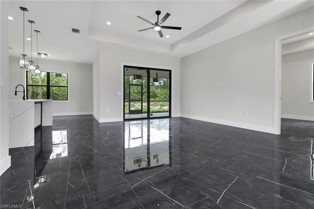 Light and bright great room with sliding doors to access the screened lanai
