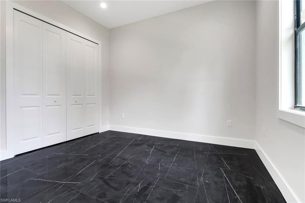 Guest bedroom with tile floors