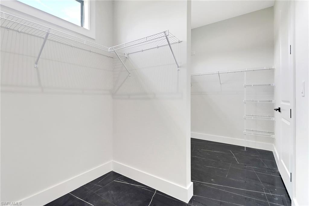 Primary bedroom includes a spacious walk in closet
