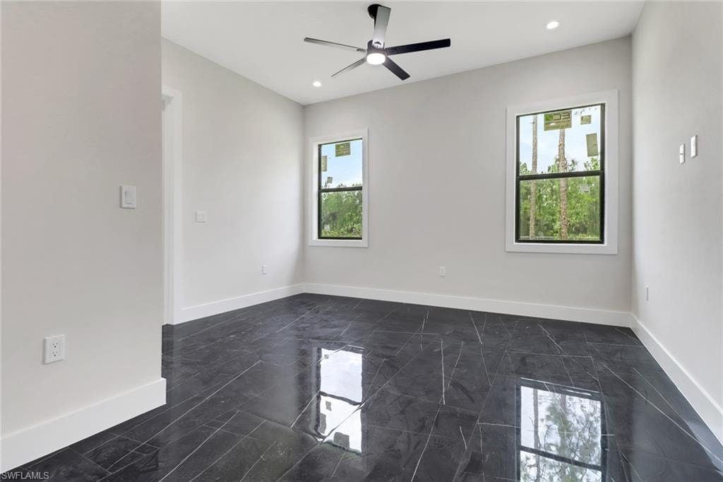 Bonus room / Media room / Home office featuring tile floors, ceiling fan, and recessed lighting