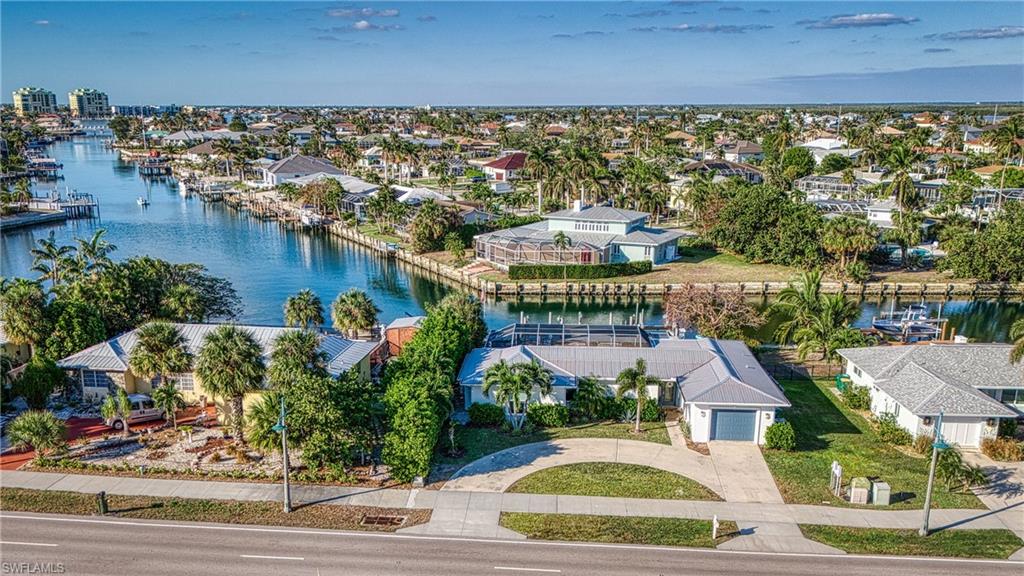 Aerial view of residential area with a nearby body of water