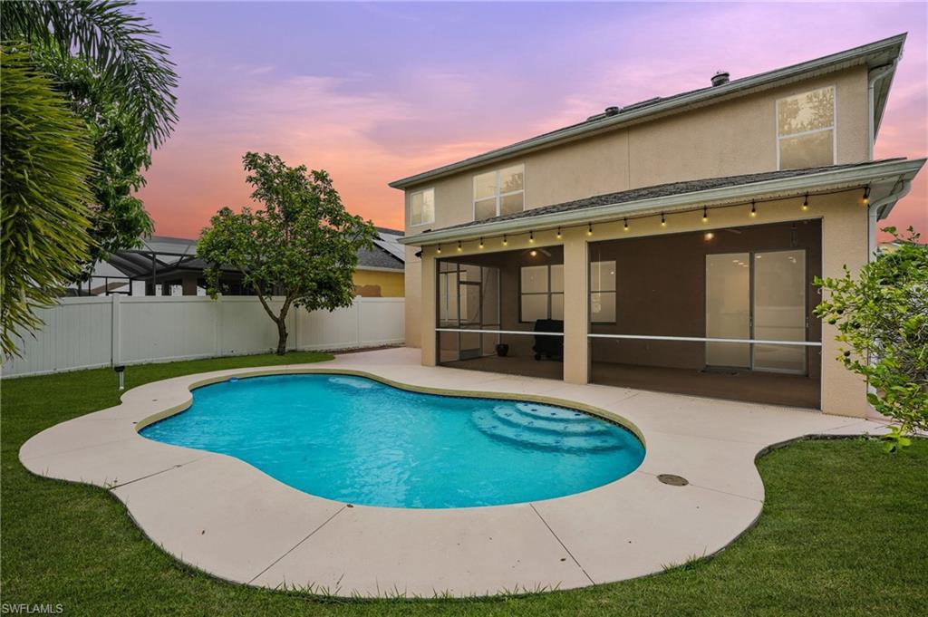 View of swimming pool featuring a sunroom and a patio