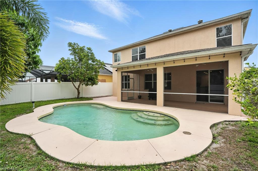 View of swimming pool featuring a patio area and a sunroom