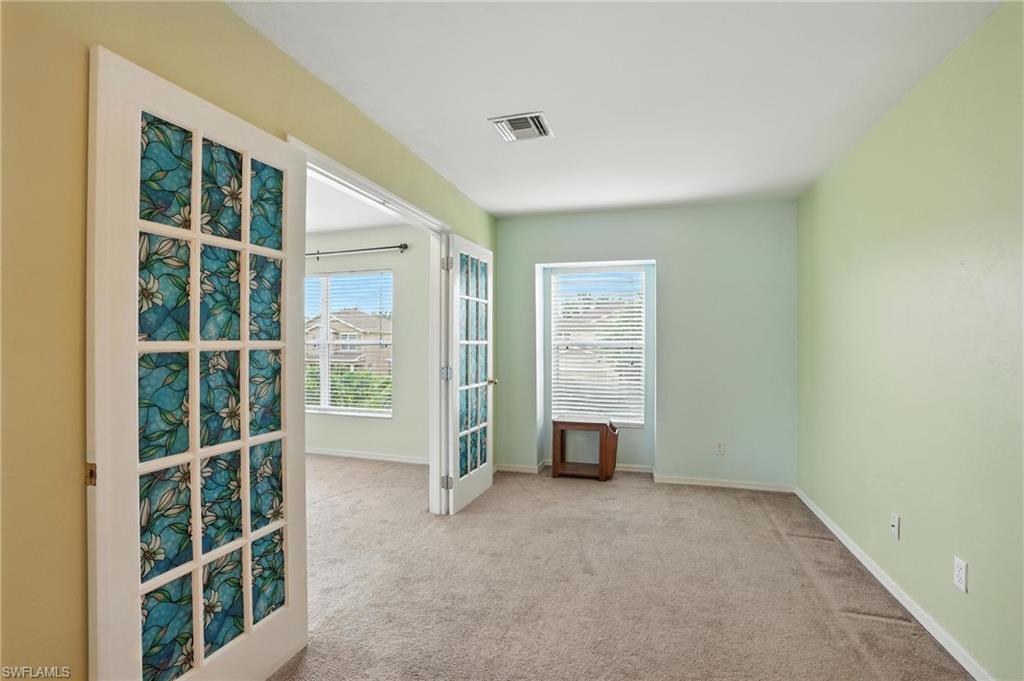 Carpeted empty room with plenty of natural light