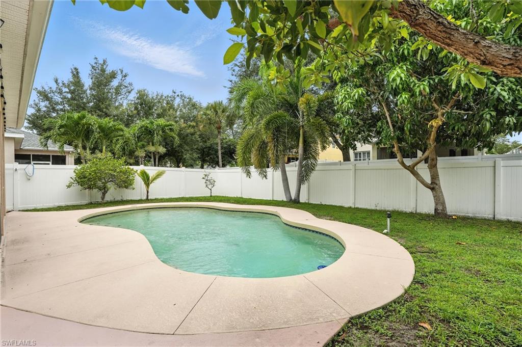 View of swimming pool with a patio area and a fenced backyard