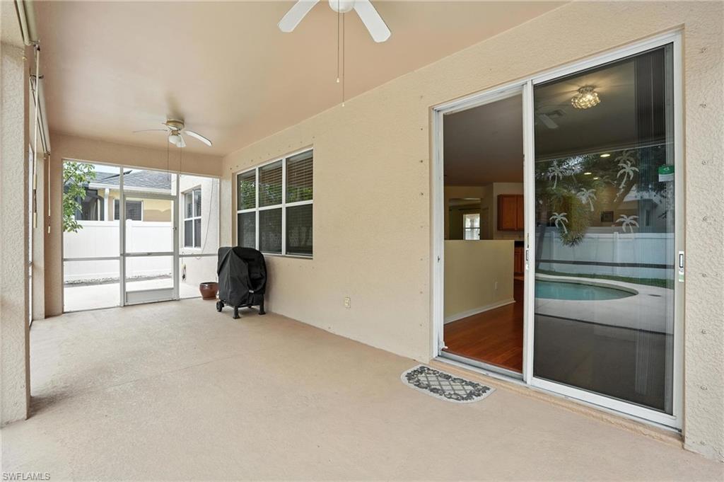 Unfurnished sunroom with a ceiling fan