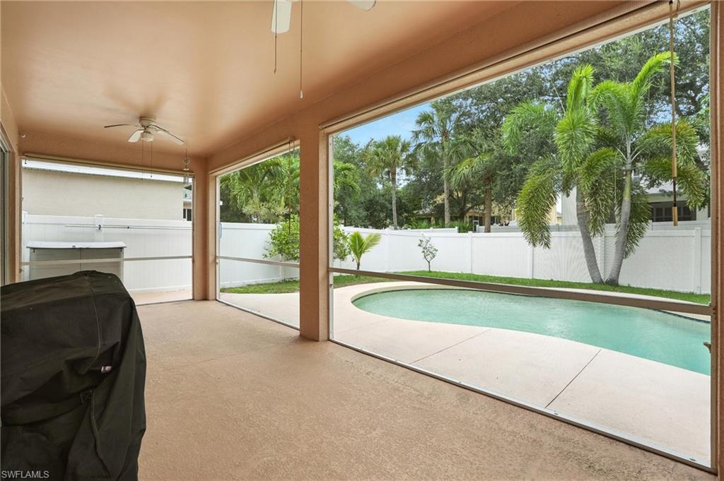 View of swimming pool featuring a ceiling fan and grilling area