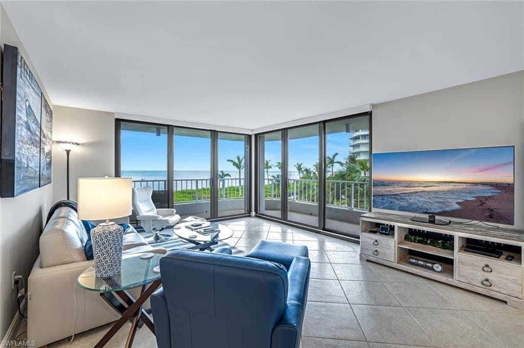 Tiled living room with expansive windows
