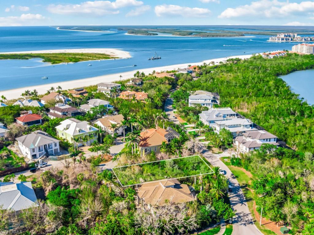 Aerial perspective of suburban area with a nearby body of water