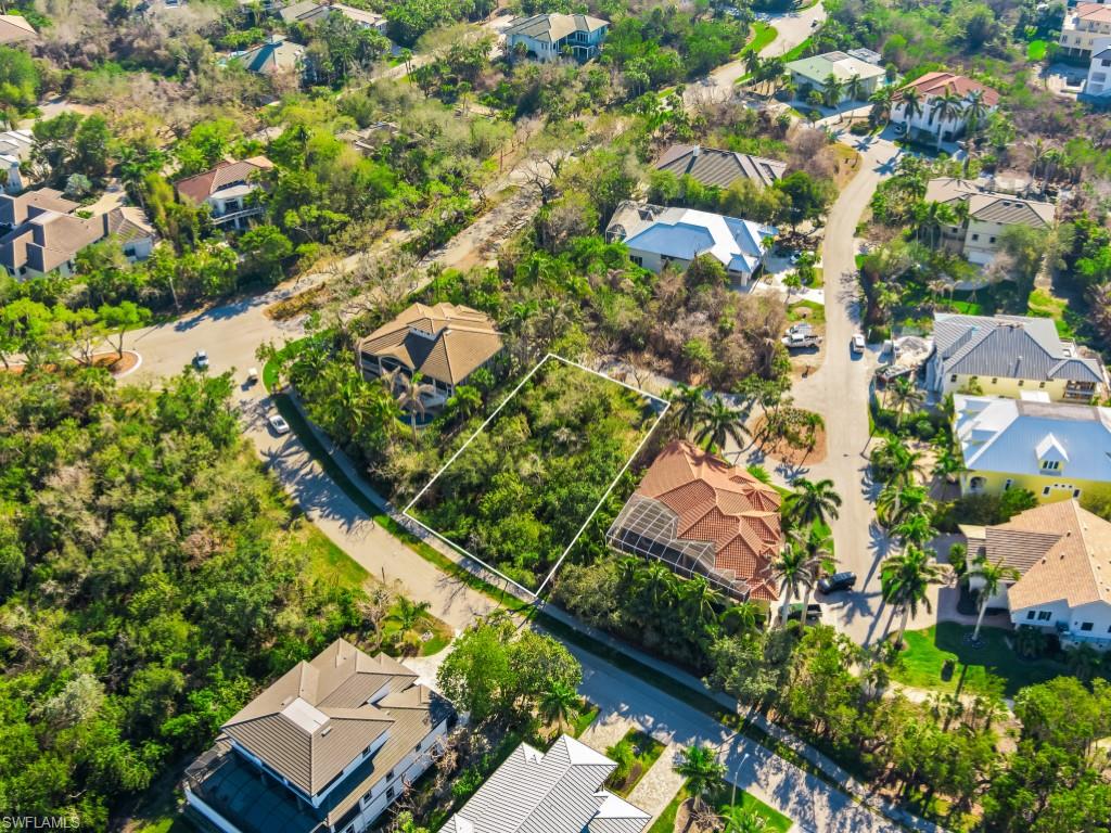 Aerial perspective of suburban area featuring property parcel outlined