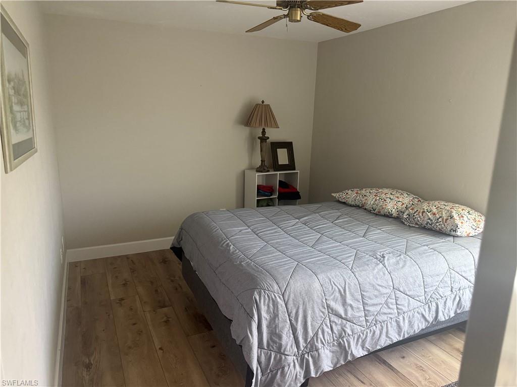 Bedroom with wood finished floors and ceiling fan