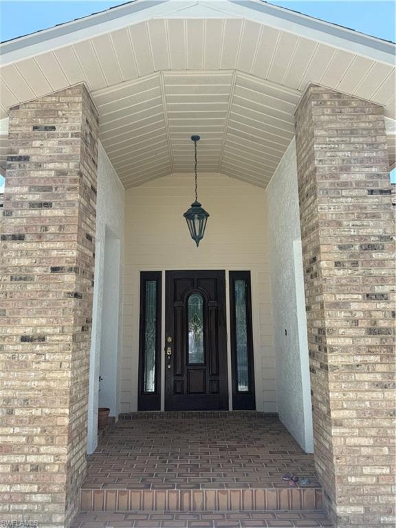 Property entrance with stucco siding