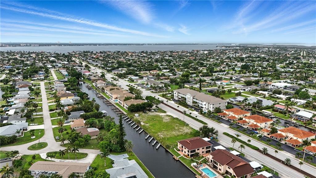 Aerial view of residential area with a large body of water