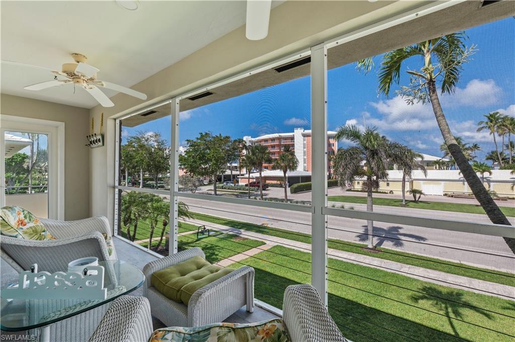 Sunroom featuring a ceiling fan
