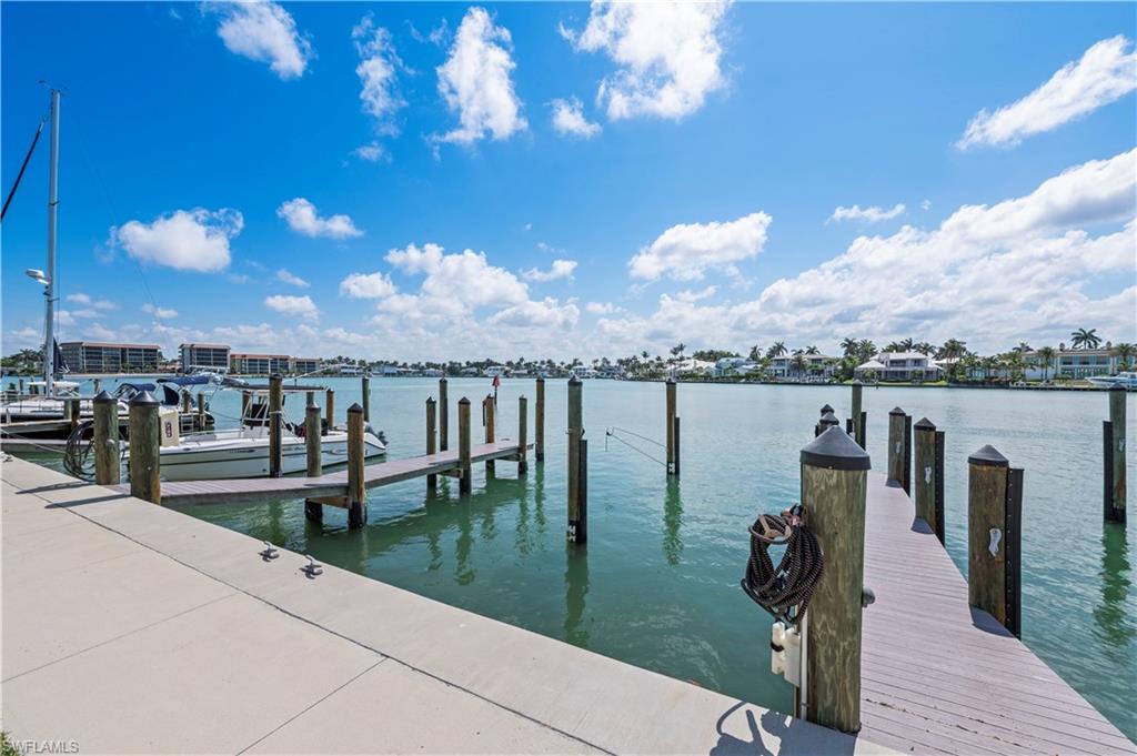 Dock area featuring a water view