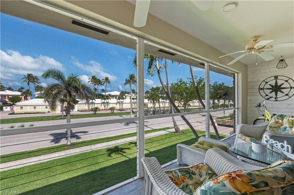 Sunroom featuring a ceiling fan