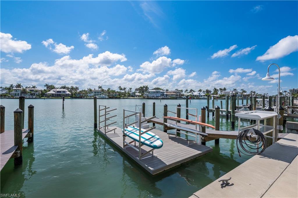 Dock area featuring a water view
