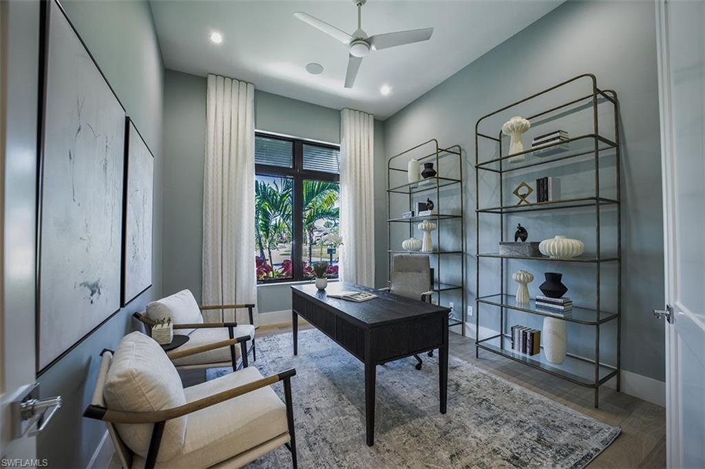 Office space featuring light wood-style flooring and ceiling fan