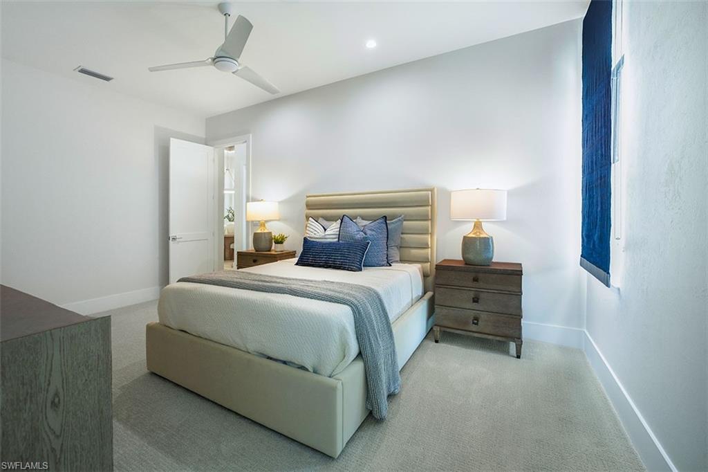 Bedroom with carpet floors, a ceiling fan, and recessed lighting