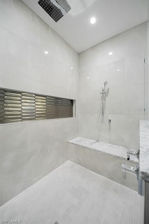Full bathroom with a tile shower
