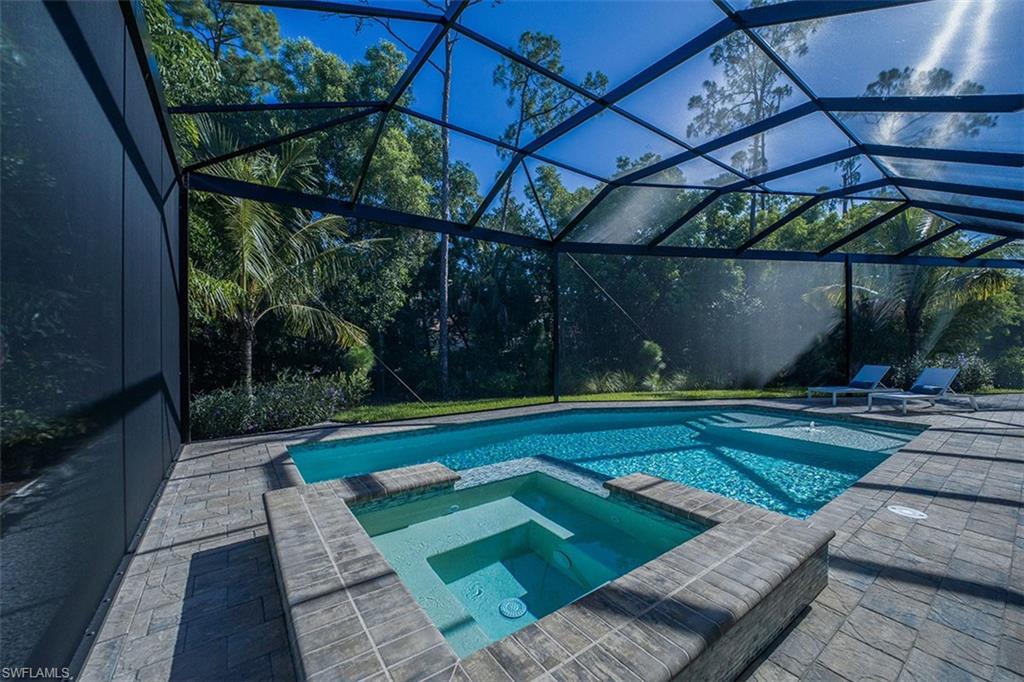 View of swimming pool with a lanai, a sunroom, and a patio area