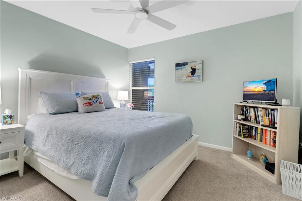 Bedroom with carpet flooring and a ceiling fan