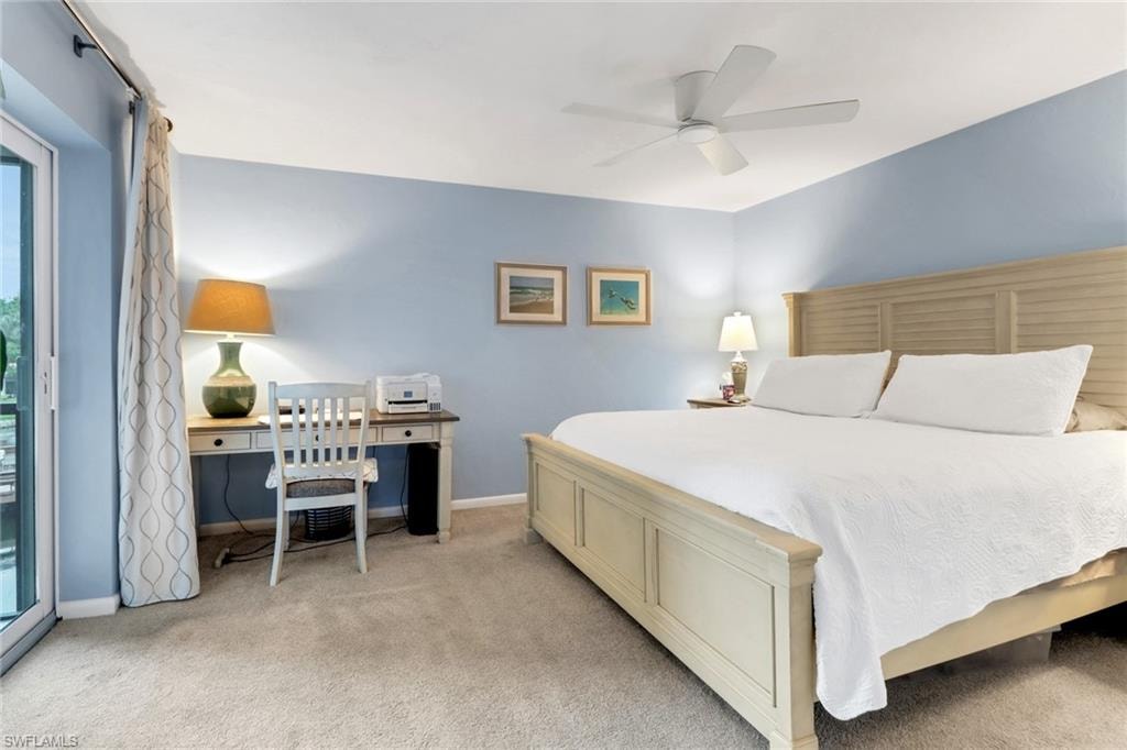 Bedroom featuring light colored carpet and ceiling fan