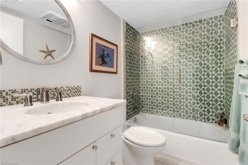Full bathroom with vanity, bathing tub / shower combination, and tile patterned floors