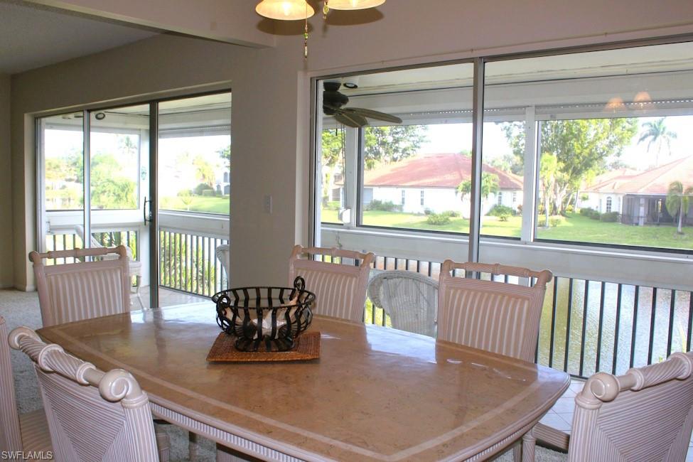 Dining area with a ceiling fan and plenty of natural light